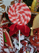 Ornaments shaped like red and white peppermint lollipops.