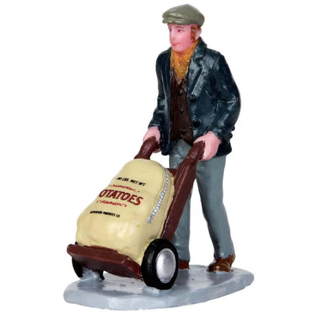 Polyresin figurine for a Lemax display. Designed to look like a man pushing a cart of potatoes.