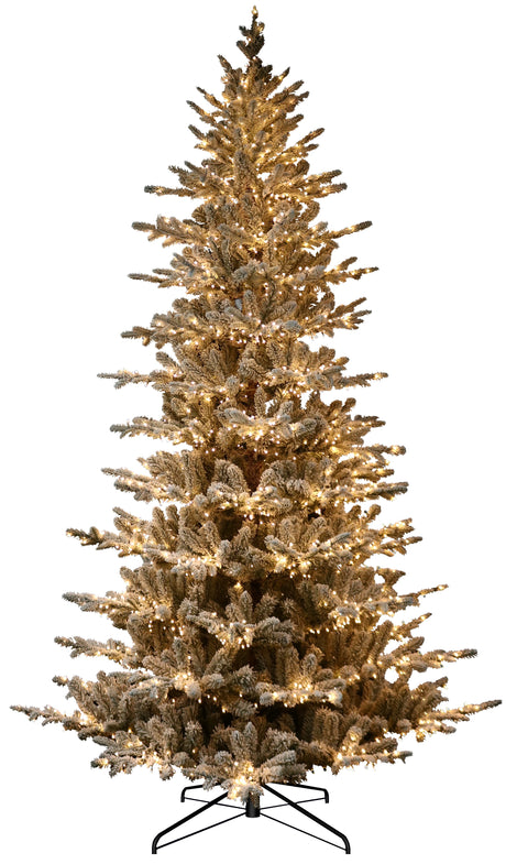 Artificial tree pre-lit with Starry lights. Branches are covered in white to appear covered in snow.