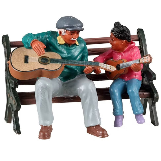Resin figure for a Lemax display. Designed to look like an older gentleman teaching a young girl how to pay the guitar. They're both sitting on a bench and smiling at each other.