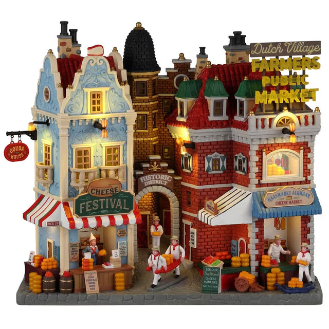 Resin lighted building facade for a Lemax display. Designed to look like a bunch of different store fronts in a public farmer's market. There's a cheese shop, a historic district and a cheese market.