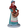 Resin figurine for a Lemax display. Designed to look like a woman dressed for winter holding a bunch of wooden logs in her apron. She has curly red hair and is wearing a bonnet.