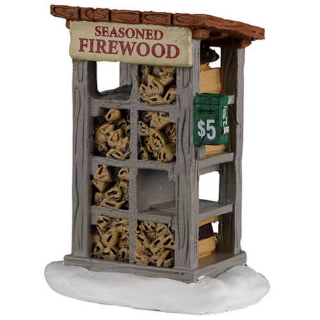 Resin village accessory for a Lemax display. Designed to look like a shelf filled with firewood for sale for $5.