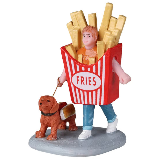 Polyresin figurine for a Lemax display. Designed to look like a small child dressed as a box of French fries. He's walking a small dog dressed like a hot dog.