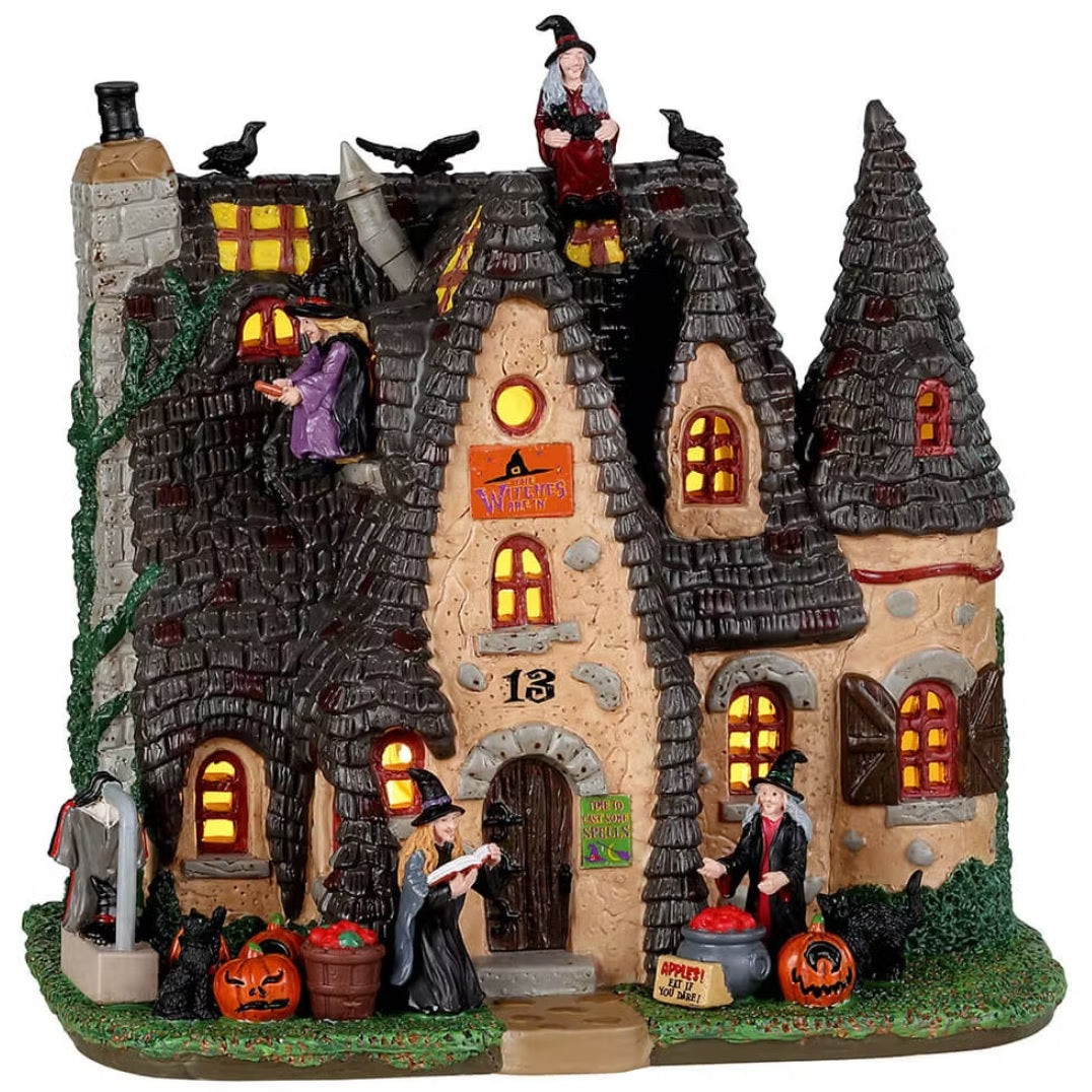 Porcelain building for a Lemax display. Designed to look like a large mansion covered in vines, crows and witches.