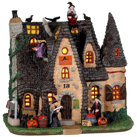 Porcelain building for a Lemax display. Designed to look like a large mansion covered in vines, crows and witches.