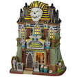 Porcelain lighted building for a Lemax display. Designed to look like a tall, light green building with an Egyptian mummy statue on the roof. There are skeletons, tombstones and snakes.