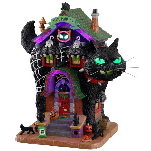 Polyresin building for a Lemax display. Designed to look like a mansion shaped like a black cat wearing a red, spiky collar. There are cats and jack-o-lanterns. The backend of the cat statue has a large spiderweb on it.