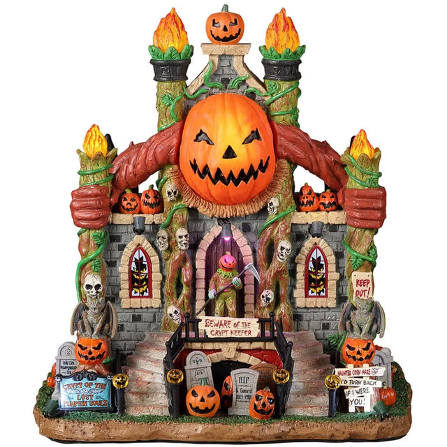 Resin building for a Lemax display. Designed to look like a crypt decorated with carved pumpkins, skulls, flames, vines, tombstones and broken windows.