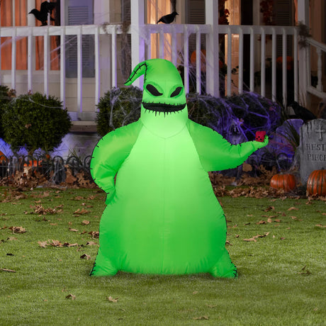 Halloween inflatable designed to look like Oogie Boogie, the villainous bag of bugs from the movie The Nightmare Before Christmas. His burlap sack glows neon green and he's holding some red dice.