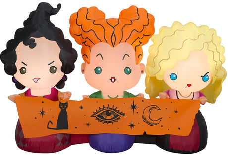 Halloween inflatable decoration designed to look like the three Sanderson sisters from the movie Hocus Pocus. They're all wearing their iconic witch outfits and holding a scroll with a cat, an eye and a crescent moon on it.