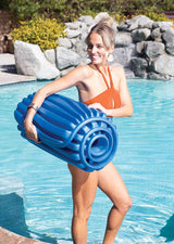 Blue foam pool mattress that rolls up.