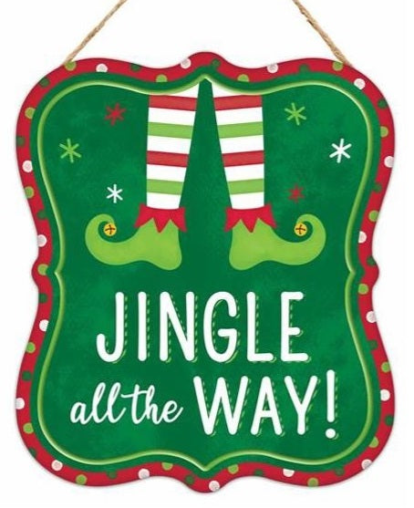 Sign has a red border with green, light green and white polka dots. It features elf legs and it reads "Jingle all the way!"