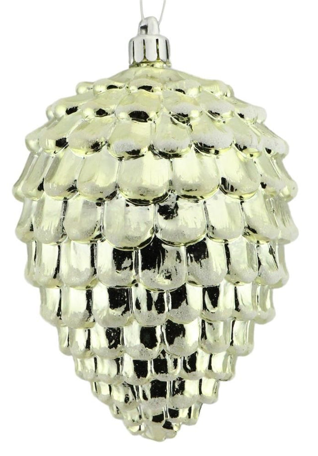 Shiny, gold ornament shaped like a pine cone.