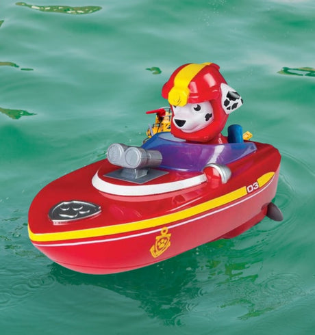 Pool toys shaped like different characters from the show Paw Patrol driving different things. One is driving a boat, one is driving a bulldozer, one is driving a police boat and one is flying a plane.