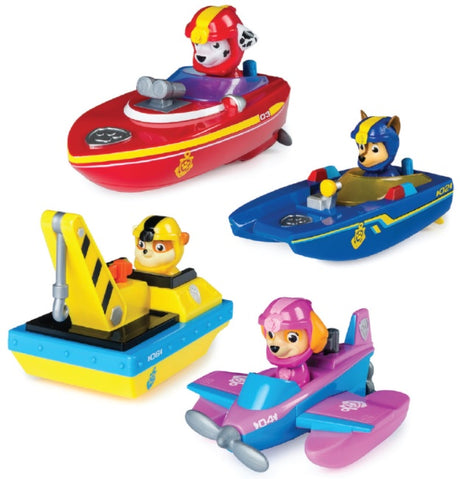 Pool toys shaped like different characters from the show Paw Patrol driving different things. One is driving a boat, one is driving a bulldozer, one is driving a police boat and one is flying a plane.
