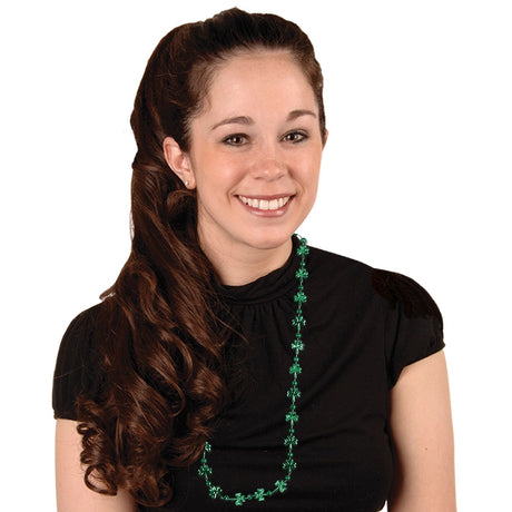 Shiny, green beaded necklace. The beads on the necklace switch between round and shamrock shaped.