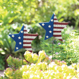 Lawn stake shaped like a star. The left side of the star is blue with white stars. The right side of the star is red and white striped.