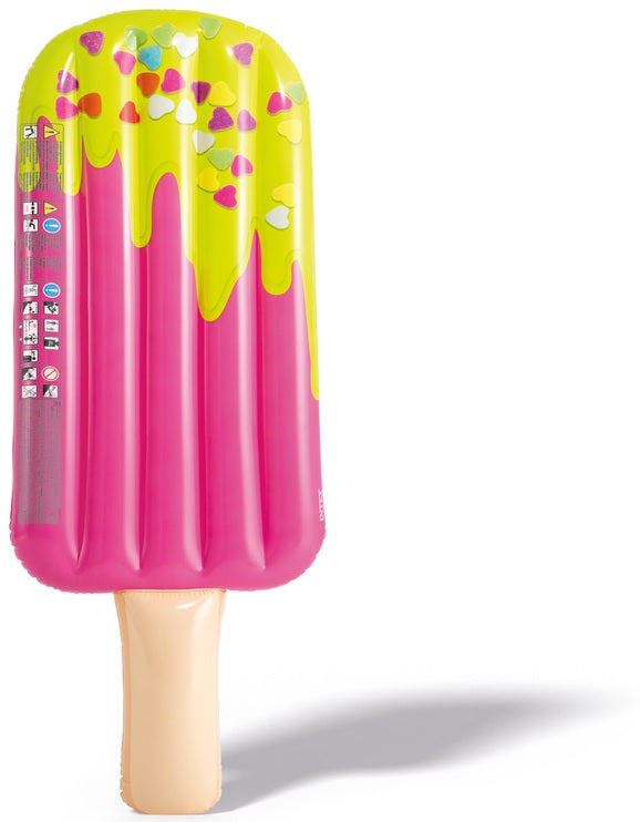 Inflatable pool float shaped like a pink popsicle. The tip of the popsicle looks like it's dipped in yellow frosting with heart shaped sprinkles on it.