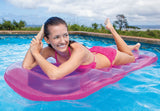 Inflatable pool mattress with a built-in contoured pillow. There are two color options: teal or pink.