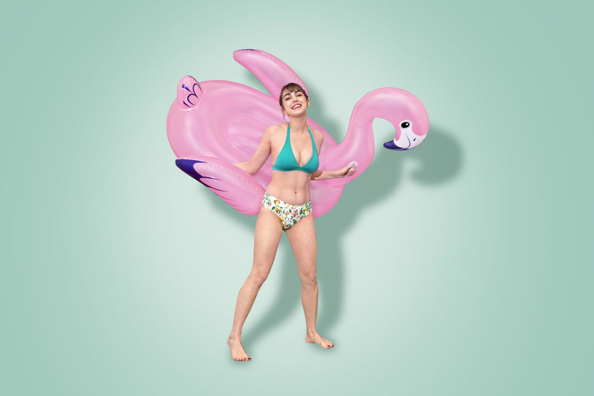 A pink pool inflatable shaped like a flamingo.