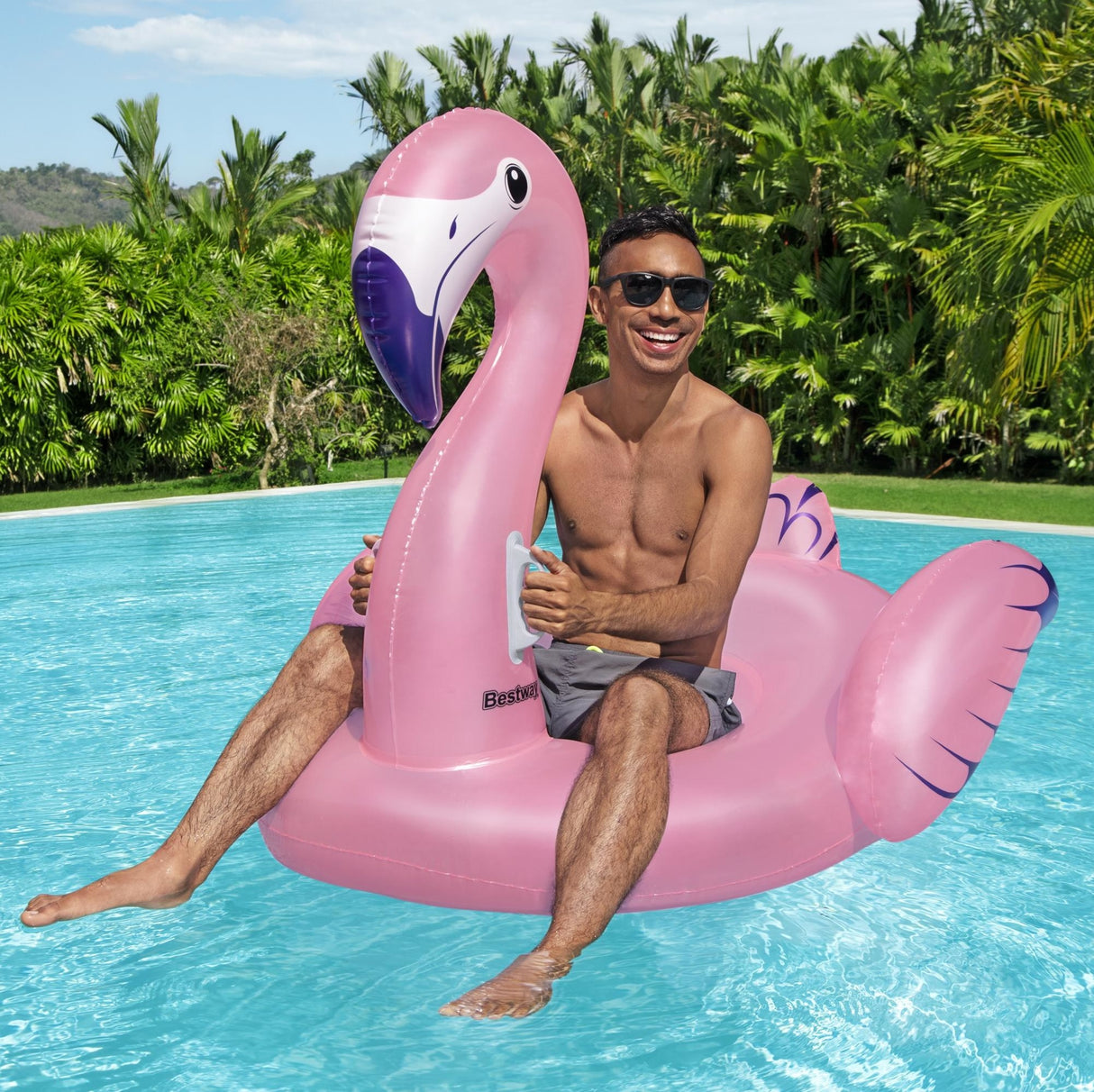 A pink pool inflatable shaped like a flamingo.