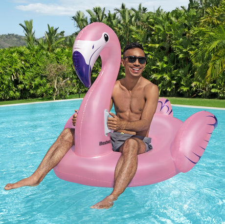 A pink pool inflatable shaped like a flamingo.