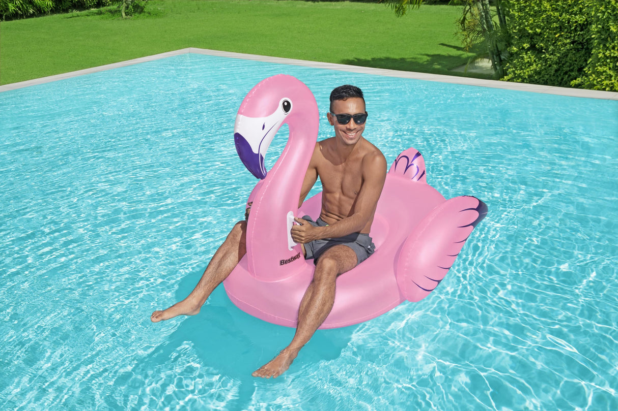 A pink pool inflatable shaped like a flamingo.