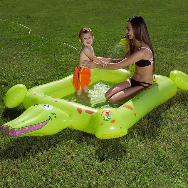 Inflatable pool for kids shaped like a square crocodile.