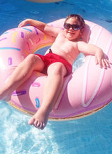 Double-bit, donut-shaped inner tube with pink frosting and a sprinkled design.