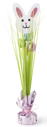 A tabletop decoration for Easter. Designed to look like a bunny hiding in a long, bright green grass with a few glitter eggs