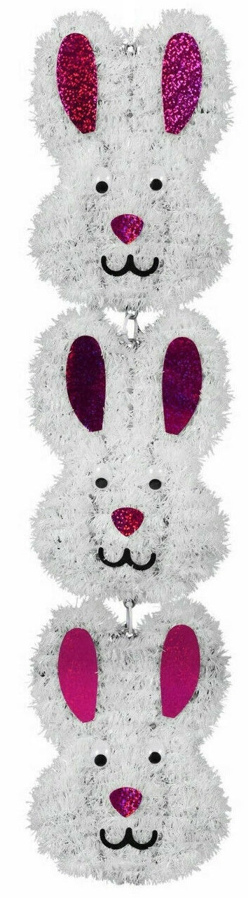 A 2D tinsel hanging decoration for Easter consisting of three cute, smiling bunny heads. Colors are white and shiny pink