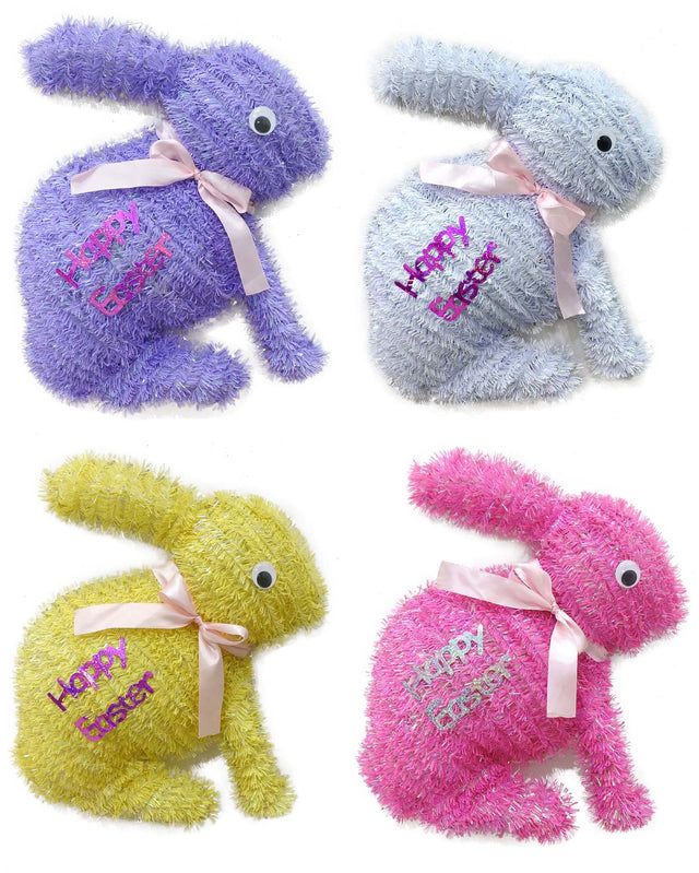 Tinsel tabletop decoration shaped like bunnies that read "HAPPY EASTER" and features a light pink bow around its neck