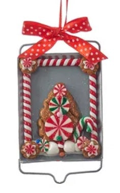 Ornaments designed to look like cookies in silver cut outs or on trays.