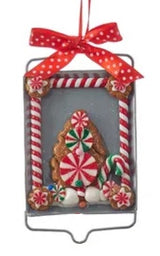 Ornaments designed to look like cookies in silver cut outs or on trays.