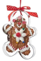 Ornaments designed to look like cookies in silver cut outs or on trays.