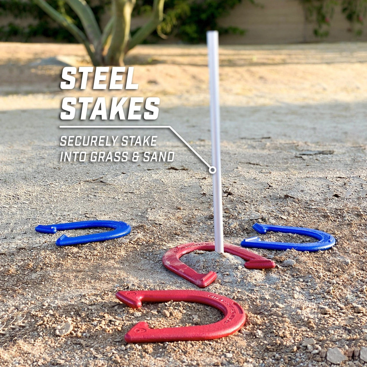 This image shows the steel stake securely in sand with horseshoes around it. The stakes can also go in grass.