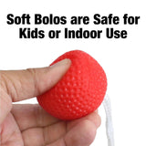 This image shows someone squishing the bolo ball to prove how soft and safe for kids they are.