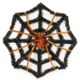 Black tinsel decoration shaped like a web with a spider in the center. One features a purple spider and the other features an orange spider.