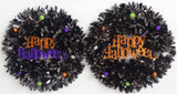 Black tinsel wreath that reads "Happy Halloween."