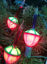 Red, green and blue bubble lights being displayed on a tree.