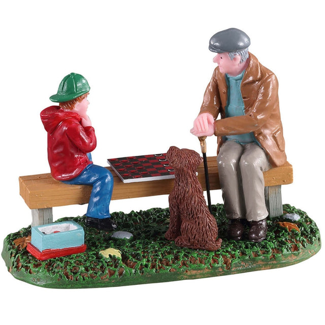 Polyresin figurine for a Lemax Village display. Designed to look like a Grandpa teaching a young child how to play checkers on a wooden bench while a dog watches