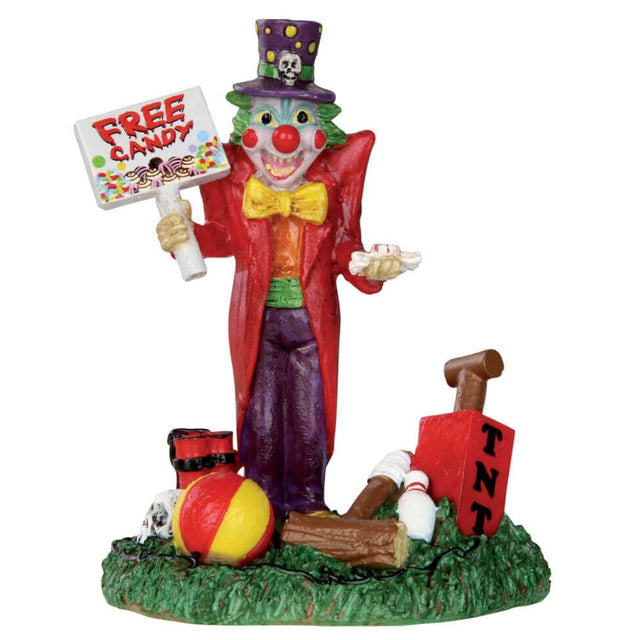 Polyresin figurine for a Lemax Spooky Town display. Designed to look like a smiling clown. He's holding a sign that reads "FREE CANDY." There are props at his feet: a beach ball, a mallet, a bowling pin, a TNT pump and dynamite. The clown is wearing a purple top hat, a red suit jacket, an orange shirt, a green cummerbund and purple pants.. He has a yellow bow tie and green hair.