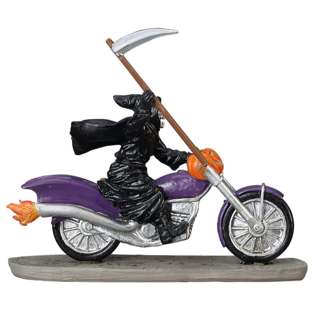 Polyresin figurine for a Lemax display. Designed to look like the Grim Reaper riding a purple motorcycle. There's a pumpkin on the front of the motorcycle. The Grim Reaper is holding a scythe.