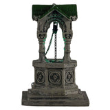 Plastic village accent for a Lemax display. Designed to look like an old, gothic well. The well is decorated with skulls, gargoyle heads and chains. There's a green light coming from inside.