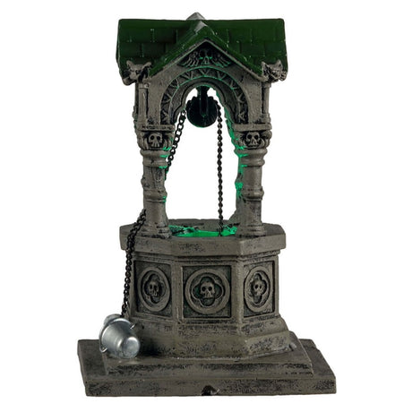 Plastic village accent for a Lemax display. Designed to look like an old, gothic well. The well is decorated with skulls, gargoyle heads and chains. There's a green light coming from inside.