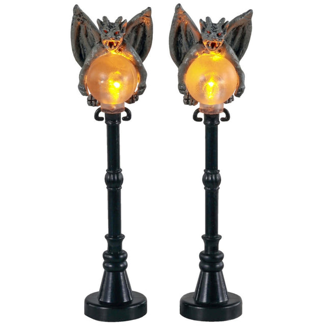 Plastic village accessories for a Lemax display. Designed to look like two lampposts with gargoyles on top.