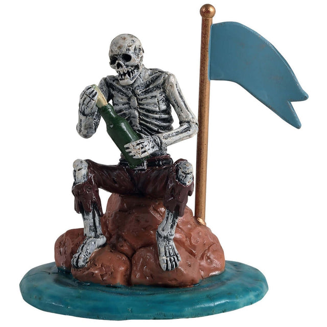 Polyresin figurine for a Lemax Spooky Town village display. Designed to look like a skeleton sitting on a rock holding a bottle. He's putting a message in the bottle and wearing tattered, old pants. There's a gold flag pole with a blue flag on it. The rock he's sitting on is in the water.