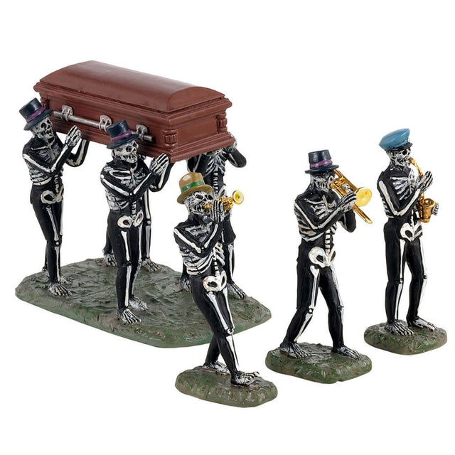 Polyresin figurines for a Lemax Spooky Town display. There are four skeletons holding up a coffin. There are three skeletons playing instruments. Each skeleton is wearing a hat.