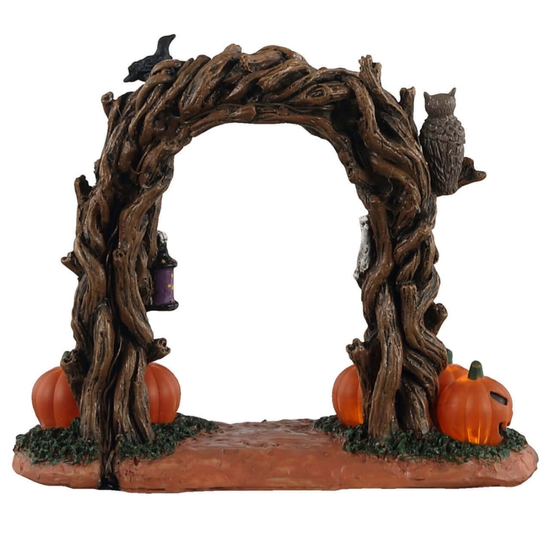 Plastic village accessory for a Lemax Spooky Town display. Designed to look like an arch made of branches. There are skulls and crows and an owl perched on it. There are two skeletons inside the arch that are holding lights. There are four jack-o-lanterns at the base.